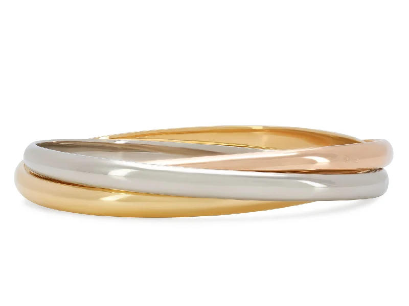 Bracelets with floral motifs for romantic touch -Cartier 'Trinity' Tri-Color Bangle in 18K Gold