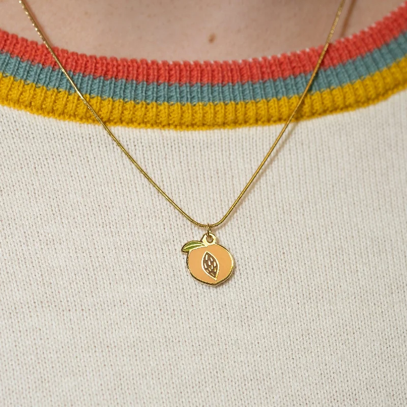 Necklaces and pendants with angel wing motifs for a spiritual, meaningful design-Peach Pit Charm Necklace